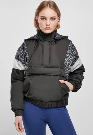 Black padded jacket with a hood, featuring gray leopard-print accents and white stripes. Elastic cuffs and a cropped hem.
