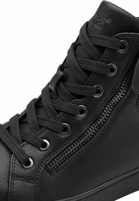 Black high-top shoes with a textured leather upper, featuring flat laces, silver eyelets, and a zip closure on the side.