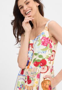 Colorful floral-patterned dress with a scoop neck, buttons down the front, and a pocket featuring a basket design. Lightweight fabric.