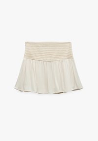 Falda de volantes en beige claro con cintura fruncida. Confeccionada con una tela suave y ligera, presenta un diseño acampanado y con volantes para mayor movimiento.