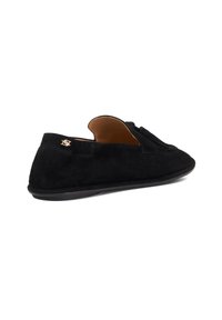 Black suede slip-on shoe with a low profile, rounded toe, and subtle branding detail. Smooth texture with minimal accents and a flexible sole.