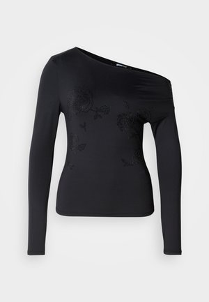 Svart langermet topp med avskåret design, med blomster mønstre laget av rhinestones foran. Glatt, elastisk stoff.