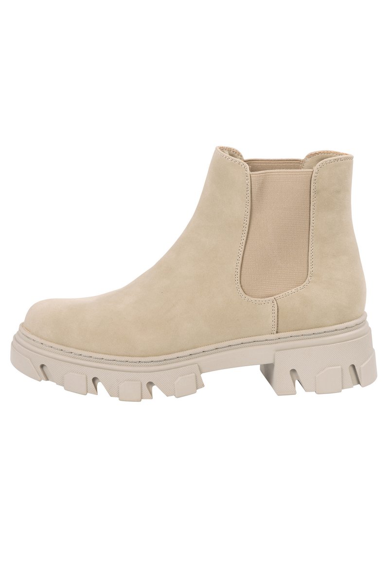 Bottine en daim beige avec des panneaux latéraux élastiques, semelle en caoutchouc texturé et un talon épais. Présente une forme arrondie et des accents cousus.