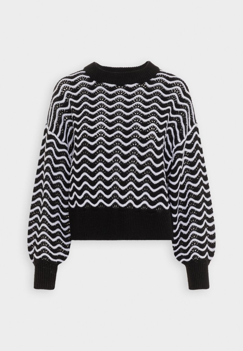 Pull tricoté noir et blanc avec de longues manches bouffantes et un motif ondulé en zigzag sur le corps et les manches.