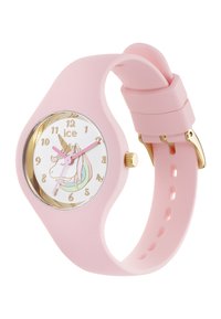 Montre en silicone rose avec un cadran blanc rond arborant un design de licorne, des accents dorés et des aiguilles rose clair. Bracelet réglable.