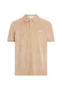 Polo shirt beige en tissu doux et texturé. Doté d'un col classique, d'une patte de boutonnage à deux boutons et d'un petit patch logo sur la poitrine.