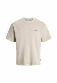 Bež majica s kratkimi rokavi, okrogel izrez in majhna oznaka "Jack & Jones" na levi strani prsnega koša.