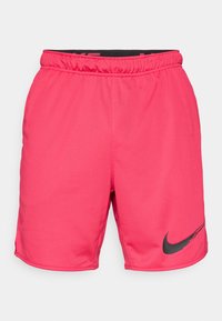 Rózsaszín sportnadrág elasztikus derékbőséggel, az alsó bal oldalon fekete Nike logóval. Simaság, könnyű anyag.