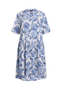 Robe légère à manches courtes en crème avec un motif floral bleu. Dispose d'un col en V et d'une taille froncée, offrant une coupe décontractée.