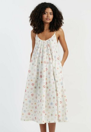 Midi-jurk met bloemenprint en een losse pasvorm, gemaakt van een lichtgewicht stof. Beschikt over een ronde halslijn, spaghetti-bandjes enzijzakken.