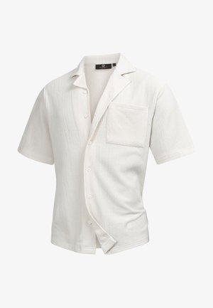 White short-sleeve shirt with a textured fabric, a button-up front, a chest pocket, and a relaxed fit.