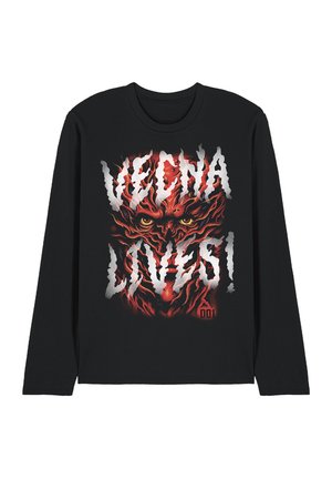 Black long-sleeve shirt with a fiery red demonic face and yellow eyes, overlaid by bold white text reading "VEGNA LOVES!"