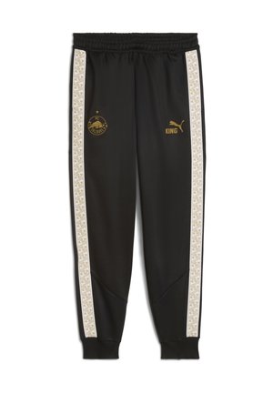 Zwarte sportieve sweats met elastische tailleband, witte zijstrepen met een geometrisch patroon, gouden logo's van Puma en FC Salzburg.