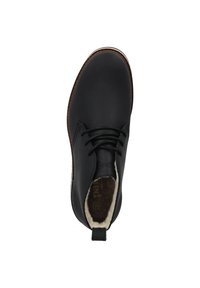 Schwarze Leder-Stiefeletten mit einer runden Zehenform, Schnürdesign und weichem, mit Fell gefüttertem Innenraum. Mit kontrastierender brauner Sohle und Fersenschlaufe.
