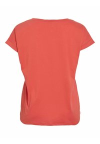 T-shirt corallo a maniche corte con scollatura rotonda e vestibilità comoda. Realizzato in morbido cotone con una texture liscia e fessure laterali.