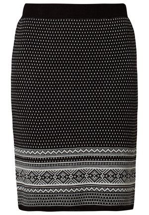 Falda negra de punto con un patrón de pequeños puntos blancos y diseños geométricos blancos intrincados cerca del dobladillo, con una cinturilla negra sólida.