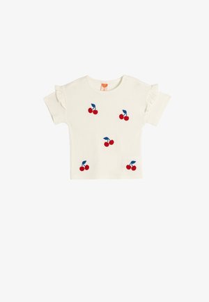 Cremefarvet baby T-shirt med korte ærmer, flæseærmer og broderede røde kirsebær med blå stilke spredt på forsiden.
