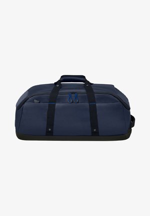 Sac de sport navy en tissu durable avec des sangles noires, une poignée supérieure et des accents de fermeture éclair bleus, présentant un design spacieux et structuré.