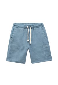 Helles blauen Shorts aus weichem Stoff, mit einem elastischen Bund und einem Kordelzug, zwei seitlichen Taschen und einer einzigen aufgesetzten Tasche.