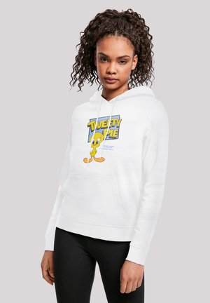 Hvid hættetrøje med et frontmotiv af Tweety Bird. Har en justerbar hætte og kengurulomme. Sammen med sorte leggings.