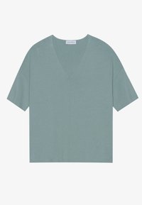 Ljusblå v-ringad kortärmad topp i mjukt material, med en avslappnad passform och subtil textur samt en mittsöm.