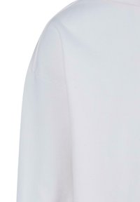 T-shirt bianco in cotone con vestibilità rilassata, scollatura rotonda e maniche corte. Il tessuto appare liscio e morbido con dettagli di cucitura minimi.