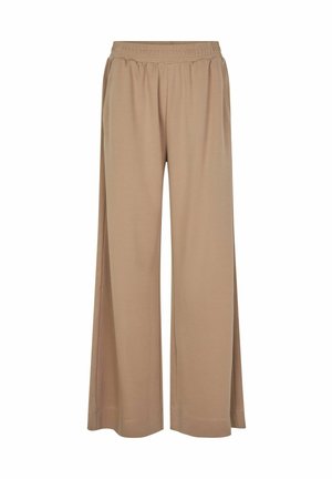 Beige laiad jalad, pehmest kangast, elastse vöökoha ja küljetaskutega. Sujuv tekstuur, lõdva ja voolava kujuga.