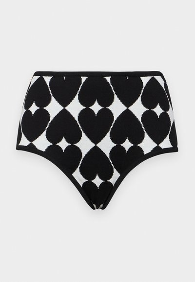 High-waisted black and white knitted briefs featuring a diamond pattern with large heart shapes. Smooth texture and elastic waistband.