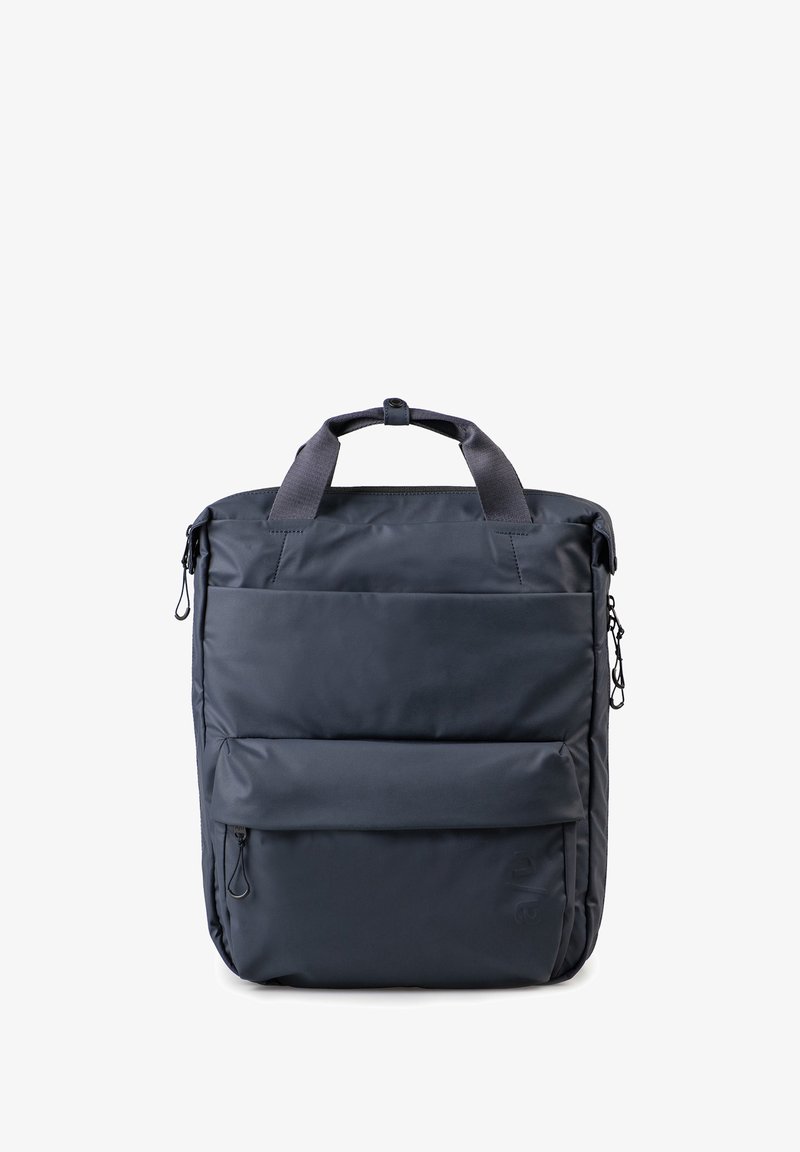 Navy blue backpack with padded exterior, dual top handles, front zip pocket, and side zipper detail. Made from durable fabric with smooth texture.