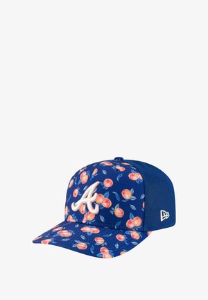 Blue baseball cap featuring a peach pattern, white embroidered logo, and mesh back panel. The brim has a floral design with peach and leaf motifs.