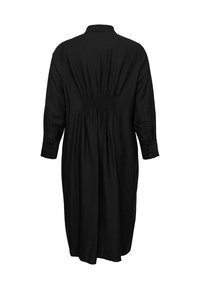 Črna midi obleka z dolgimi rokavi z nabiranim elastičnim pasom na hrbtni strani, zapenjanimi manšetami in ovratnikom, prikazana od zadaj na belem ozadju.