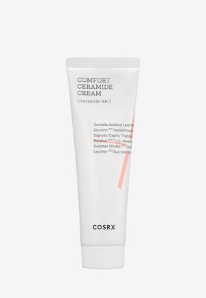 Weisse Tube der COSRX Comfort Ceramide Cream mit einem pinken Akzentstreifen. Verfügt über einen Schraubverschluss und ein Etikett mit den Inhaltsstoffen und der Marke.