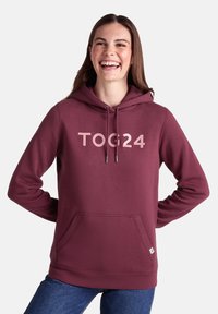 Maroon hooded sweatshirt with front pocket, featuring the text "TOG24" in light pink. Made of soft fabric with a relaxed fit.