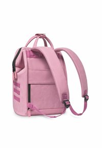 Pink backpack with a smooth, matte finish. Features padded shoulder straps, a top handle, and an external zip pocket with hardware accents.