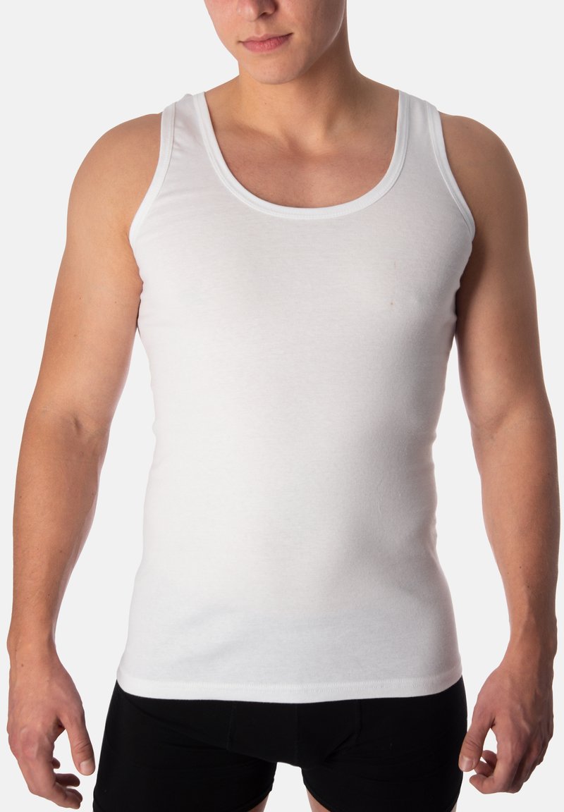 White tank top made of cotton, featuring a round neckline and narrow straps, fitted design with a smooth texture.