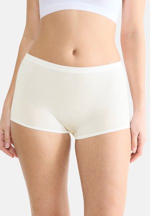 Crème-kleurige hipsteronderbroek van een zachte, rekbare stof, met een witte band in de taille en naadloze randen.