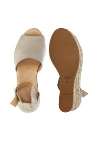 Beige ruskinds espadriller med åben tå, ankelrem og vævet jutesål. Størrelse 37, mærket "Lavet i Spanien" under. 