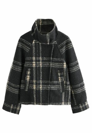 Rutig yllejacka i svart och krämfärgad, med hög krage, sidfickor och boxig passform med en asymmetrisk framknäppning.