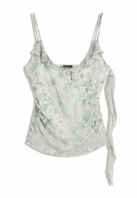 Camisola verde chiaro a fiori con spalline a spaghetto, scollatura con volant e dettaglio annodato sul lato, adagiata su uno sfondo bianco.