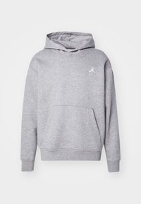 Felpa grigia con cappuccio, tasca a marsupio frontale, polsini e orlo a costine. Presenta un logo Jumpman bianco sul lato sinistro del petto. Realizzata in tessuto morbido.