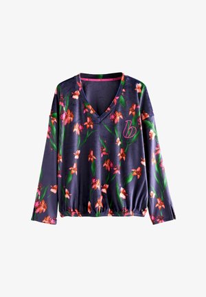 Pitkähihainen, V-pääntie, tummansininen paita, jossa on kukkakuvioitu pinkin ja oranssinorhidin kuvio. Joustohelma ja hienovarainen brändäysdetaili.