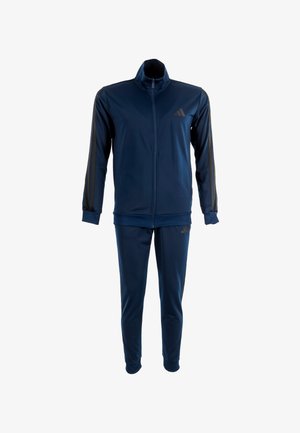 Dunkelblauer Trainingsanzug aus glattem, dehnbarem Stoff; mit einer Jacke mit Reißverschluss und hohem Kragen sowie passende Hose mit seitlichen Akzenten.