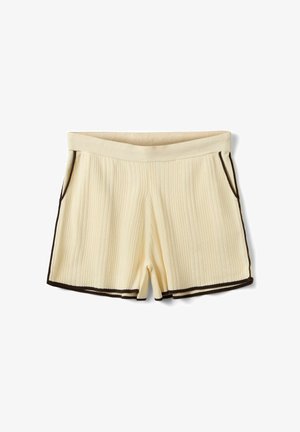Cream ribbed knit shorts with dark brown trim on pockets, sides, and hems, laid flat on a white background.