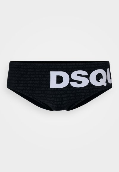 Mustad must ujumispüksid, millel on suur valge "DSQUARED2" logo ja tumedamas varjus korduv brändinimi. Sile tekstuur.