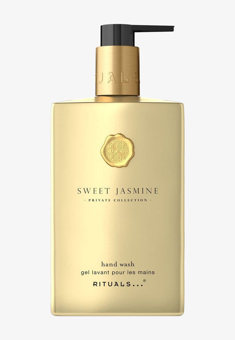 Goudkleurige handwasfles met een zwarte pompdispenser. Bevat een reliëflogo en tekst voor "Sweet Jasmine" Private Collection.