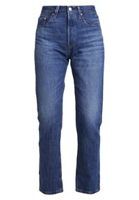 Denim jeans in een donkerblauwe wassing, met een rechte pijp, vijf-pocket ontwerp en een knoopsluiting. Licht beschadigd uiterlijk.