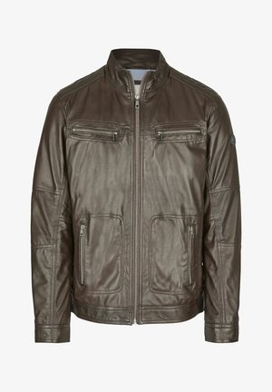 Pruun nahast jakk koos seisva kraega, ees lukk, kaks lukuga rinna taskut ja kaks madalamat taskut. Omab õmblustega detailide esitlemist.