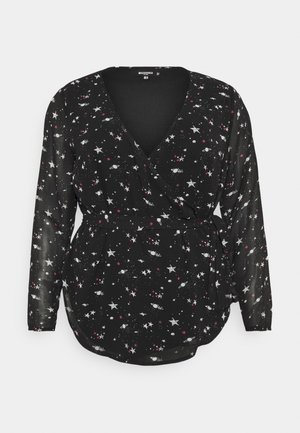 Schwarze Langarm-Wickelbluse mit weißem und rotem Stern- und Planetenmuster, ausgestattet mit einem seitlichen Bindegürtel und V-Ausschnitt.