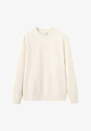 Kremna majica z dolgimi rokavi in okroglim izrezom, z rebrastimi manšetami in spodnjim robom, prikazana na enostavni beli podlagi.