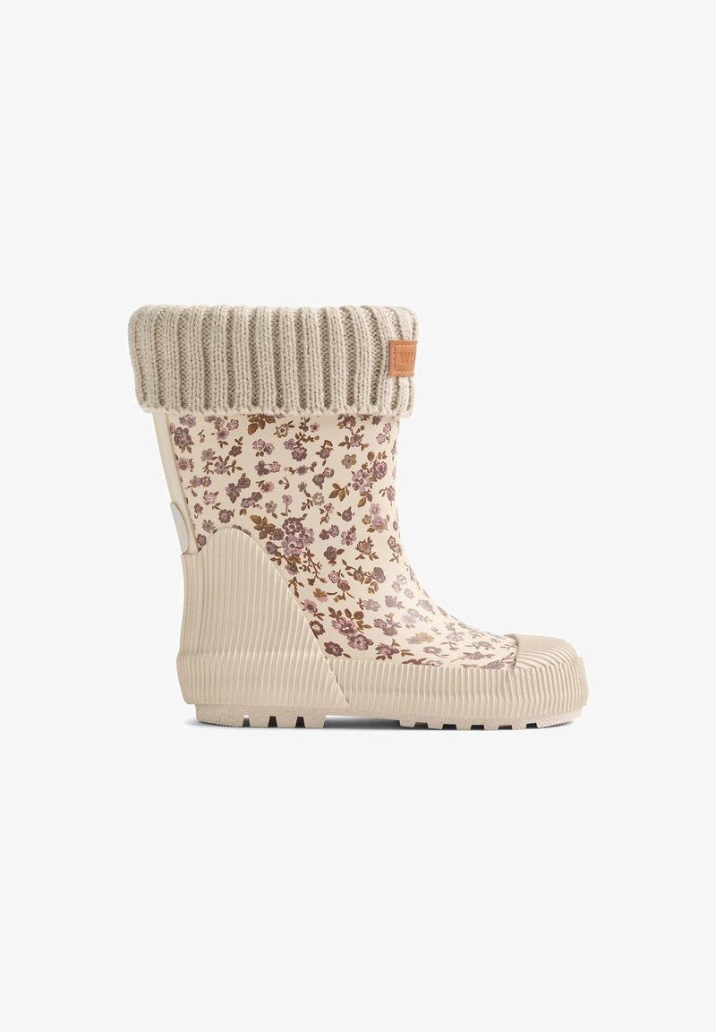 Botte de pluie en caoutchouc beige avec un motif floral en violet et marron. Elle possède un revers en tricot beige et une semelle texturée pour une meilleure adhérence.